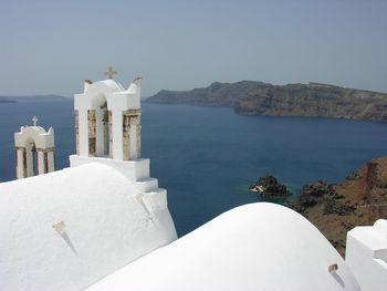 Panoramic view of sea and mountains against sky