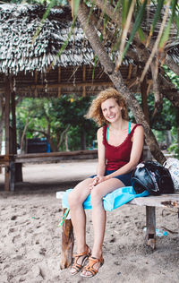 Portrait of smiling woman sitting on seat