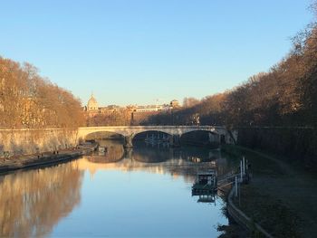 Bridge over river against clear sky