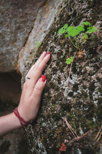 Close-up of hand on rock