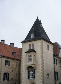 Low angle view of old building against sky