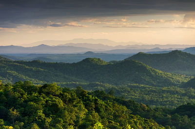 Scenic view of mountains against sky at sunset