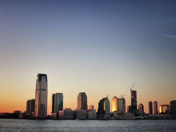 City lit up at waterfront