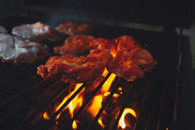 High angle view of meat on barbecue grill