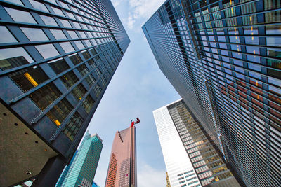 Low angle view of modern buildings against sky