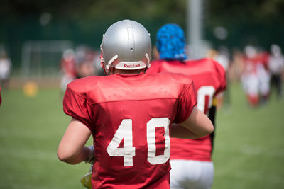 Rear view of a man with arms outstretched