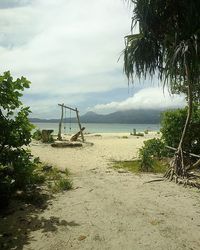 Scenic view of sea against cloudy sky