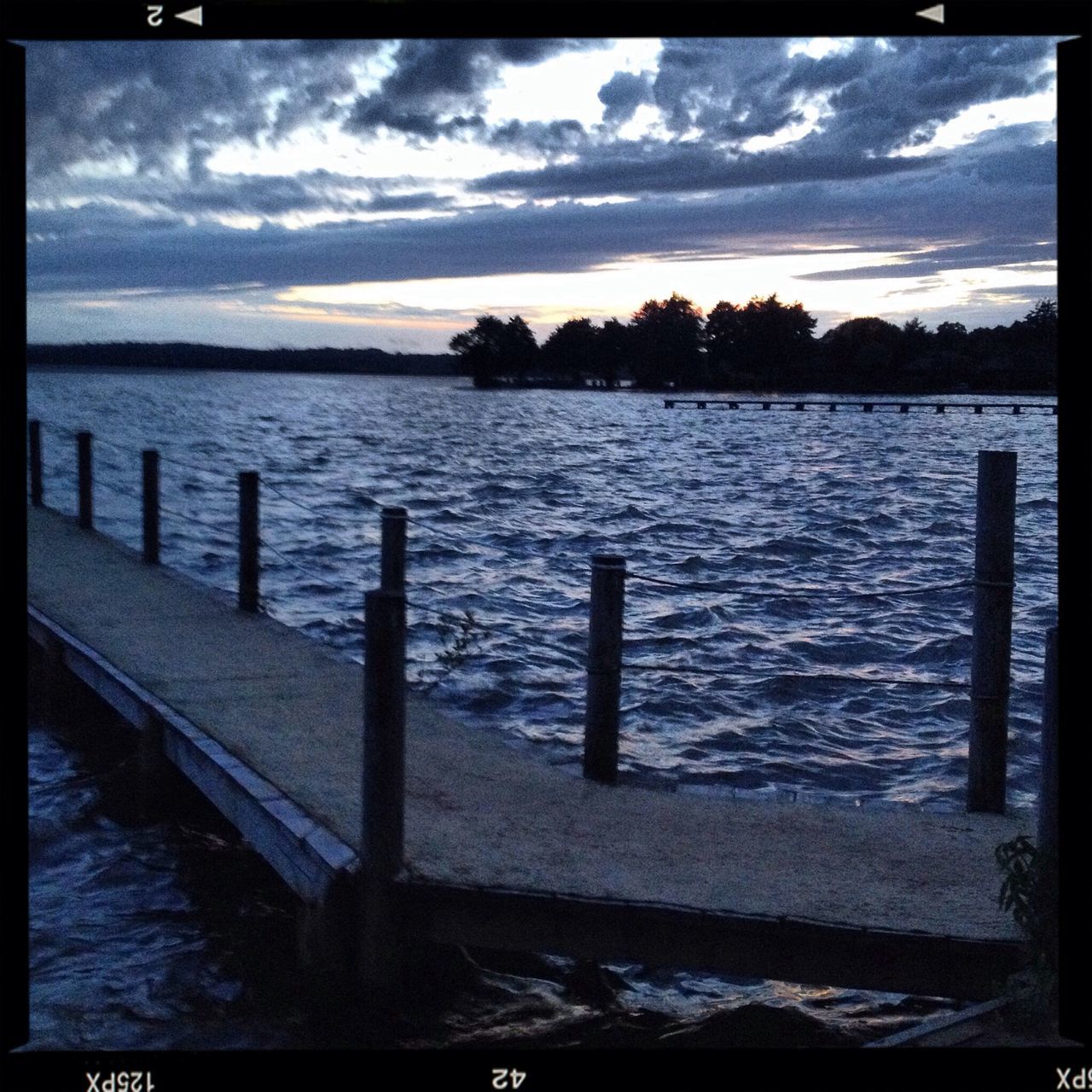 water, transfer print, sky, auto post production filter, tranquil scene, cloud - sky, tranquility, cloud, scenics, beauty in nature, pier, cloudy, sea, rippled, railing, nature, lake, river, no people, jetty