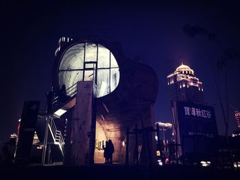 Low angle view of illuminated building at night