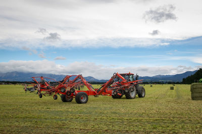 Tractor on field against sky