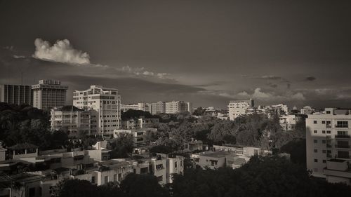 View of city against cloudy sky