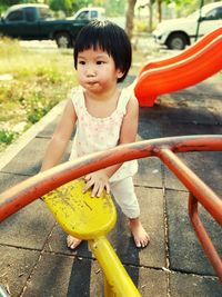 Cute girl playing in playground