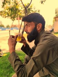 Portrait of man drinking beer glass