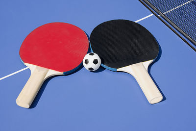 Close-up of tennis rackets on table