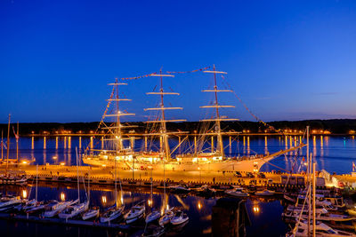 Boats moored at harbor