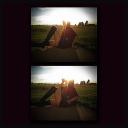 People relaxing on field seen through window