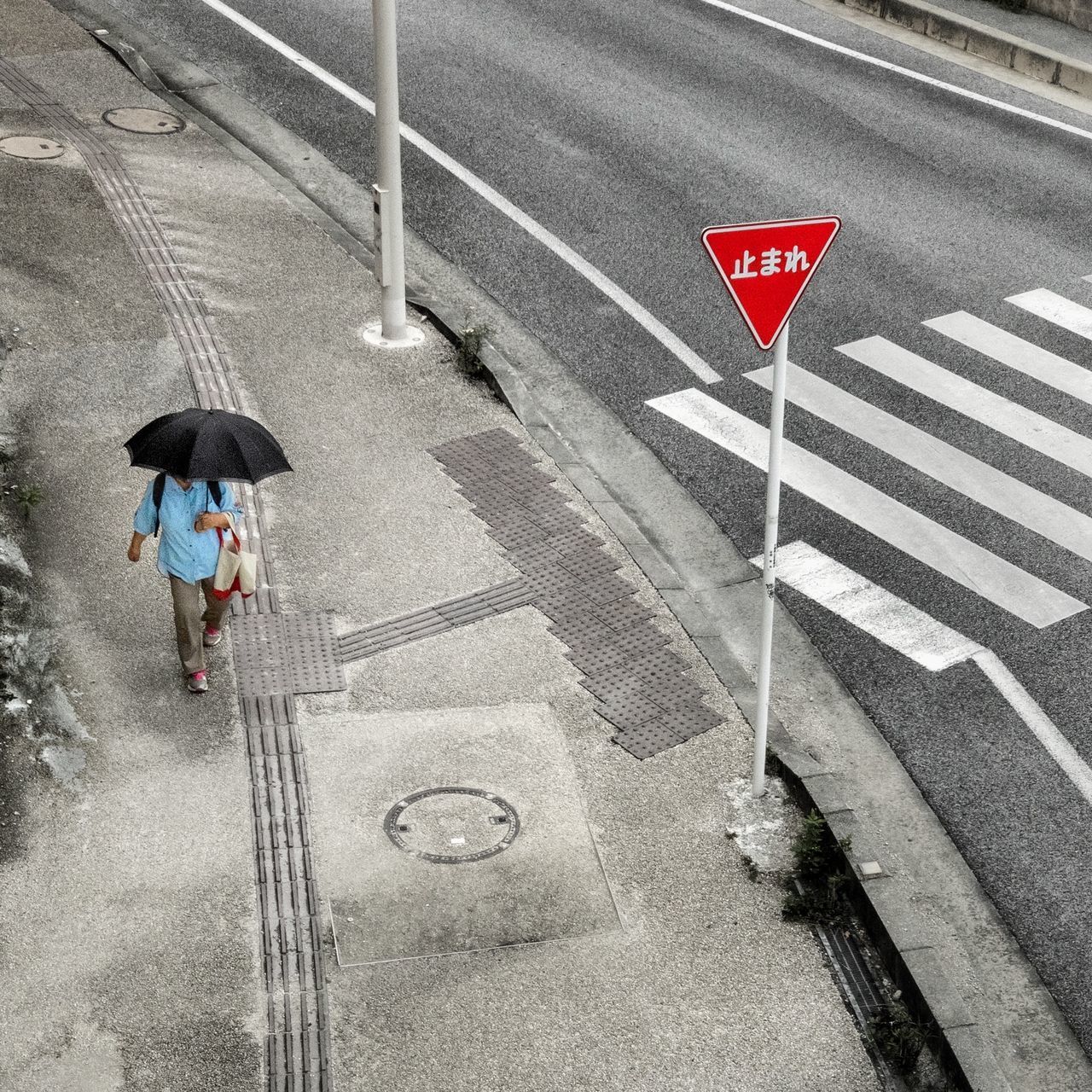 HIGH ANGLE VIEW OF ROAD SIGN