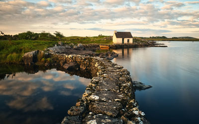  lakeside sunrise scenery of fisherman's hut   at screebe in connemara ,county galway ,ireland