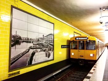 Train at railroad station against sky