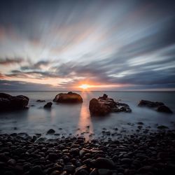 Scenic view of sea at sunset