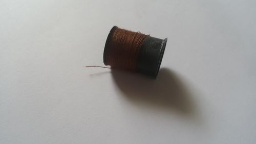 High angle view of pencil on table against white background