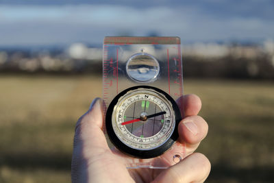 Close-up of hand holding camera