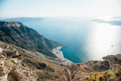 High angle view of rocks by sea against sky