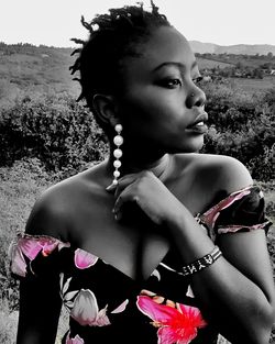 Portrait of beautiful young woman looking away