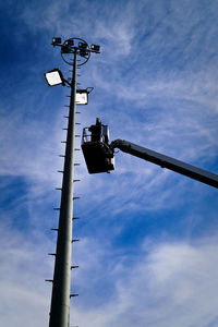 Low angle view of street light against cloudy sky