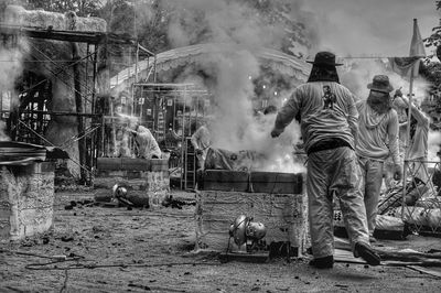 People working on street in city