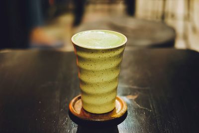 Close-up of coffee cup on table