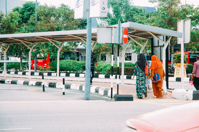 Man walking on road in city