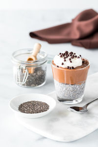 A chocolate mousse chia pudding snack ready for eating.