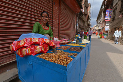 Man for sale at market stall