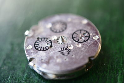 Close-up of clock on table