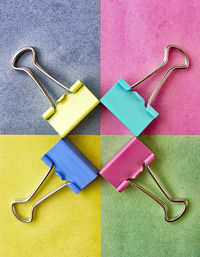 Directly above shot of colorful binder clips on table