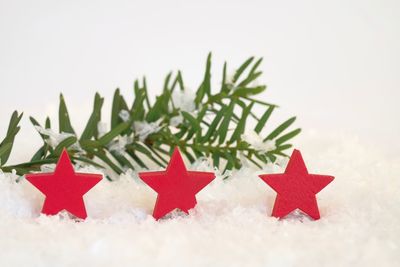 Close-up of christmas decorations over white background