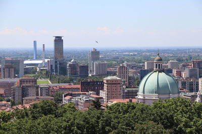 Buildings in city against sky