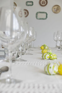 Close-up of drinking glasses on table