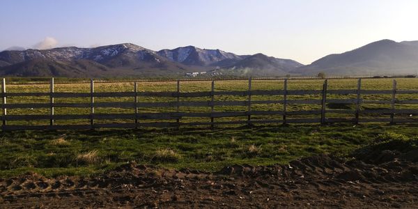 Field and hills behind the fence