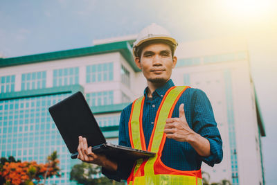 Portrait of young man using mobile phone