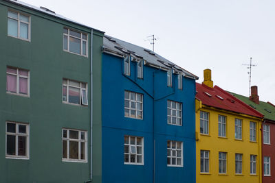 Low angle view of colorful buildings against sky