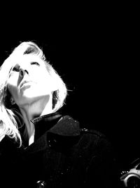 Beautiful young woman in darkroom