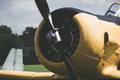 Close-up of airplane wheel against sky