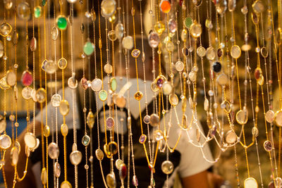 Full frame shot of illuminated lanterns hanging at store