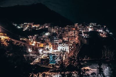 High angle view of illuminated cityscape at night