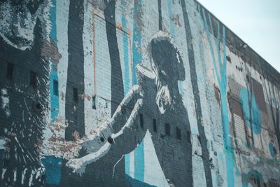 Low angle view of graffiti on building wall