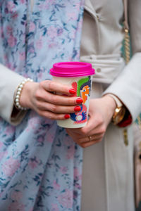 Midsection of woman holding ice cream