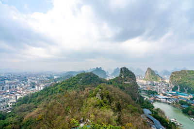 High angle view of city and buildings against sky