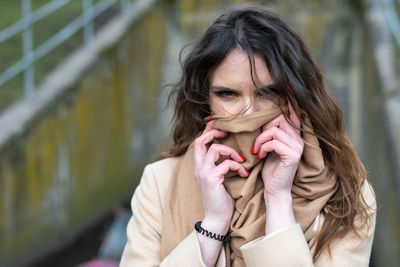 Woman with brown hair outdoors